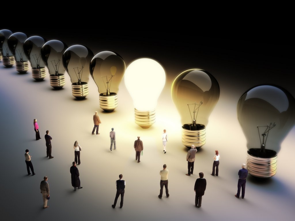 Light bulbs in a row with one being on, large group of people with a few moving to the light.