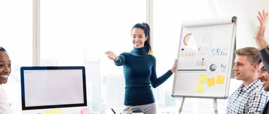 Young casual Asian businesswoman leader asking for opinion in the meeting while making a presentation, panoramic banner background