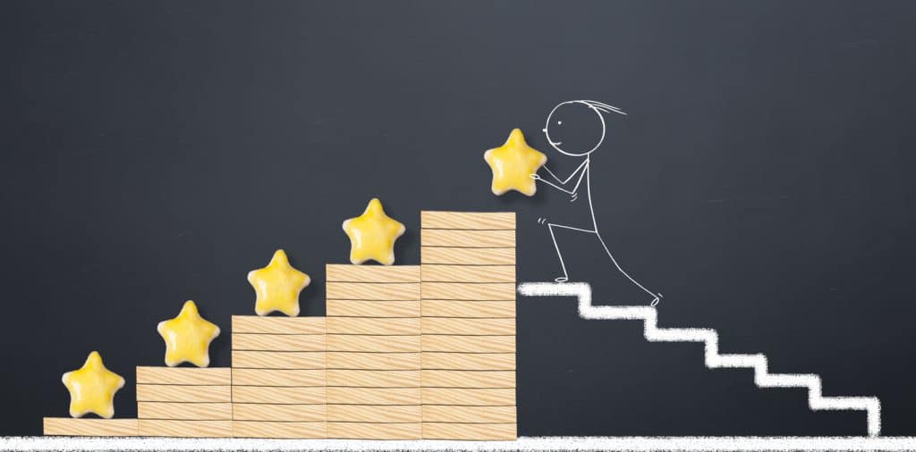 customer experience concept. man places 5 yellow stars for perfect business