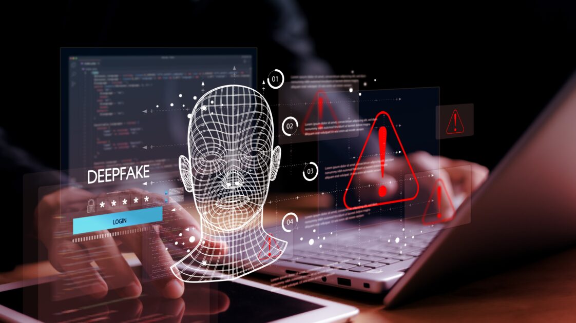 Imagem de uma análise digital de rosto humano com gráficos e alertas de perigo, relacionada a tecnologia e segurança cibernética no contexto de deekfake.