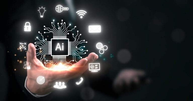 A imagem apresenta um conceito visual futurista relacionado à Inteligência Artificial e tecnologia digital. Detalhes principais: Elemento central: Um circuito eletrônico estilizado com a sigla “AI” no centro, representando um processador ou núcleo de inteligência artificial. Linhas conectadas irradiam do chip, formando uma rede que simboliza conectividade e processamento avançado. Ícones ao redor: Cadeado (segurança digital). Globo com WWW (internet e conectividade global). Wi-Fi (conexão sem fio). Envelope (comunicação digital). Engrenagens (automação e processos). Lâmpada (inovação e ideias). Alvo (precisão e estratégia). Usuários (interação humana). Carrinho de compras (e-commerce). Contexto físico: Uma mão aberta sustentando a projeção digital, sugerindo controle ou domínio sobre a tecnologia. Fundo escuro com iluminação suave, destacando os elementos digitais em tons de branco e azul brilhante, criando uma estética moderna e tecnológica. Essa imagem transmite inovação, integração de IA em diferentes áreas (segurança, comunicação, automação, comércio) e transformação digital. pib, AIops, ceos, qualcomm