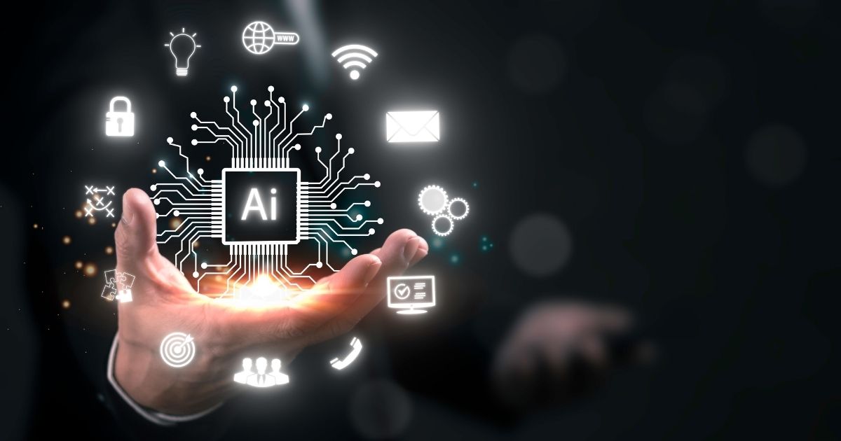 A imagem apresenta um conceito visual futurista relacionado à Inteligência Artificial e tecnologia digital. Detalhes principais: Elemento central: Um circuito eletrônico estilizado com a sigla “AI” no centro, representando um processador ou núcleo de inteligência artificial. Linhas conectadas irradiam do chip, formando uma rede que simboliza conectividade e processamento avançado. Ícones ao redor: Cadeado (segurança digital). Globo com WWW (internet e conectividade global). Wi-Fi (conexão sem fio). Envelope (comunicação digital). Engrenagens (automação e processos). Lâmpada (inovação e ideias). Alvo (precisão e estratégia). Usuários (interação humana). Carrinho de compras (e-commerce). Contexto físico: Uma mão aberta sustentando a projeção digital, sugerindo controle ou domínio sobre a tecnologia. Fundo escuro com iluminação suave, destacando os elementos digitais em tons de branco e azul brilhante, criando uma estética moderna e tecnológica. Essa imagem transmite inovação, integração de IA em diferentes áreas (segurança, comunicação, automação, comércio) e transformação digital. pib, AIops, ceos, qualcomm