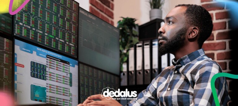 Profissional de TI analisando painéis de monitoramento de dados e indicadores financeiros em múltiplos monitores, representando a governança de dados aplicada à IA